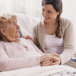 nurse and elderly outdoors