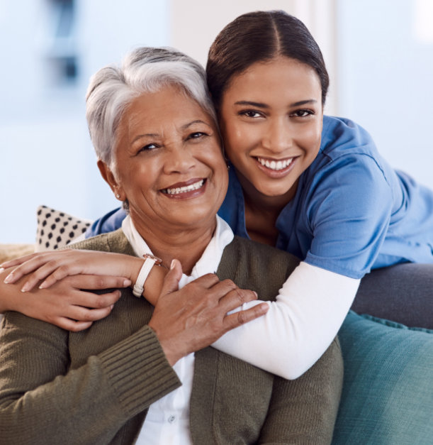 carer and senior woman smiling