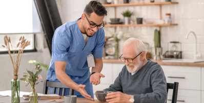 healthcare worker serving food to an elderly