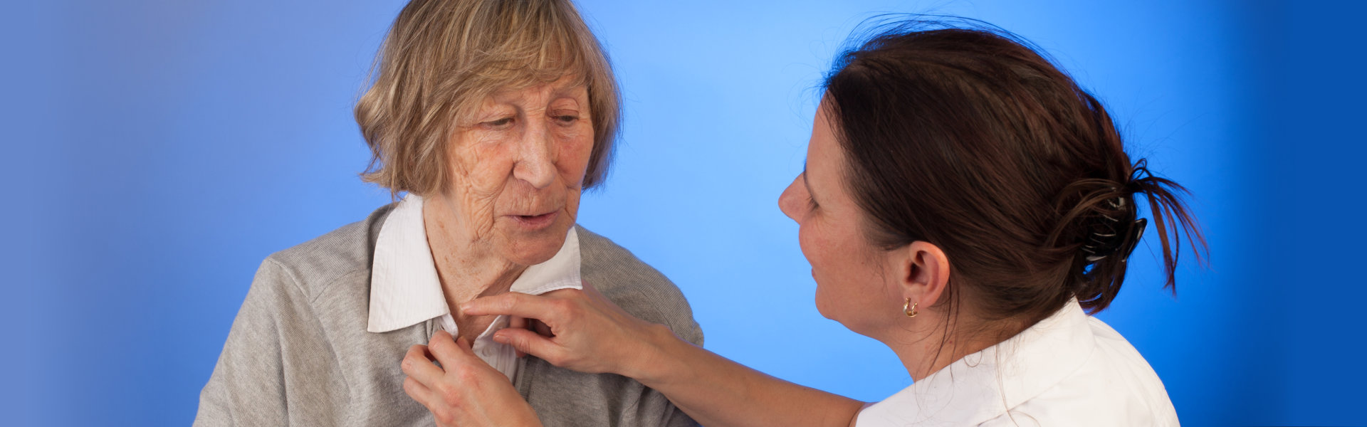 healthcare worker assisting an elderly