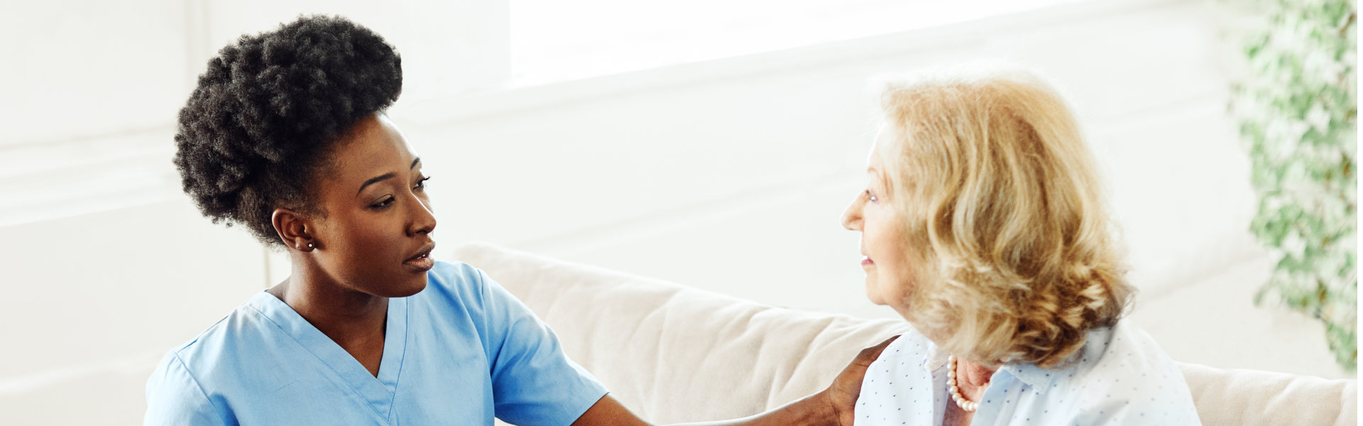 medical worker and senior woman talking